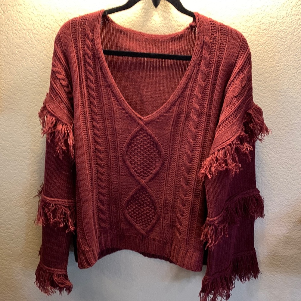 Cute bohemian like sweater. Can be worn off shoulder as well